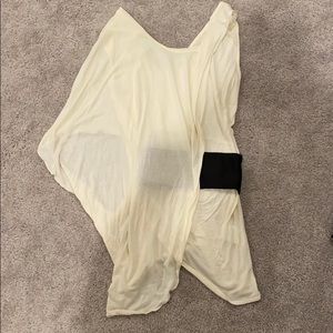 Venus. Cream flowing top with black tuxedo belt